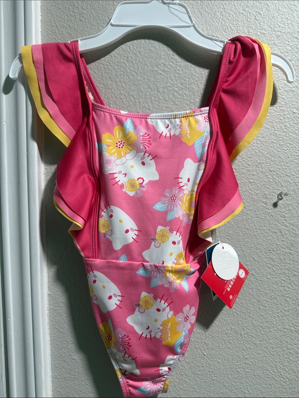 Hello Kitty Pink Floral Ruffle One-Piece Swimsuit with Yellow Trim. New size 6